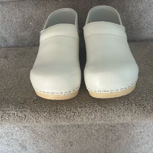 Dansko Cream Leather Clogs